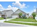 A well-kept single-Gathering home with a beautiful lawn and a mailbox in front of the property at 5670 Terracotta Trce, McCordsville, IN 46055