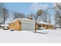 Brick ranch home with attached garage and basketball hoop at 6436 Oakview S Dr, Indianapolis, IN 46278