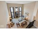 Two-story living room with fireplace and ample natural light at 6711 Colville Pl, Indianapolis, IN 46236