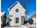 Gray two-story house with a front porch and small yard at 857 S Tompkins St, Shelbyville, IN 46176