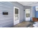 Front porch with two entrances and a mailbox at 857 S Tompkins St, Shelbyville, IN 46176