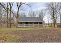 Log cabin home exterior with a spacious yard at 1084 Chipmunk Ln, Pendleton, IN 46064