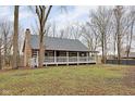 Charming log cabin home nestled in a wooded setting at 1084 Chipmunk Ln, Pendleton, IN 46064