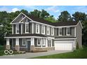 Two-story house with gray siding, stone accents, and a two-car garage at 13371 Vickery Ridge Dr, Fishers, IN 46037