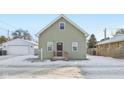 Newly renovated gray house with snowy yard at 1418 S New Jersey St, Indianapolis, IN 46225