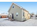 Side view of gray house with snowy yard at 1418 S New Jersey St, Indianapolis, IN 46225