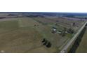 Aerial view showing a farmhouse, barn, and expansive property at 1545 S Us 421, Zionsville, IN 46077