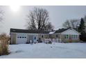 Ranch-style home with attached garage; snowy front yard at 1545 S Us 421, Zionsville, IN 46077