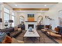 Bright and airy living room featuring a fireplace, hardwood floors, and modern furnishings at 15844 Nocturne Dr, Westfield, IN 46074
