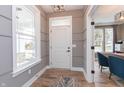 Welcoming entryway featuring wood floors, gray walls, and lots of natural light at 1837 Luther St, Indianapolis, IN 46203