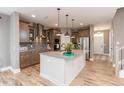 Spacious kitchen with a large island, stainless steel appliances, and wood floors at 1837 Luther St, Indianapolis, IN 46203