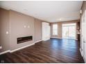 Bright living room with sleek fireplace, hardwood floors, and an open floor plan at 1902 Zwingley St, Indianapolis, IN 46203