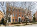 Attractive brick townhome with traditional architectural details, enhancing curb appeal at 2010 Rhettsbury St, Carmel, IN 46032