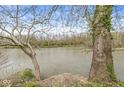 Peaceful river view featuring mature trees, providing a serene natural backdrop to the property at 2230 E 75Th St, Indianapolis, IN 46240