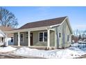 New construction home with a covered porch and gray siding at 241 Cleveland St, Columbus, IN 47201