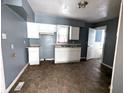 Kitchen with white cabinets and tiled floor at 3050 N Gladstone Ave, Indianapolis, IN 46218