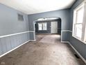 Spacious living room with grey walls and carpeted floor at 3050 N Gladstone Ave, Indianapolis, IN 46218