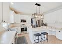 Spacious kitchen featuring white cabinets, stainless steel appliances, and an island at 5230 Berkshire South Blvd, Greenwood, IN 46142
