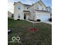 Two-story house with attached garage and tree in front yard at 6628 Heben Ct, Indianapolis, IN 46113