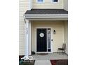 Black front door with a circular wreath and sidelights at 6628 Heben Ct, Indianapolis, IN 46113