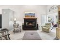 Living room featuring a fireplace and comfortable seating at 8176 Foxchase Cir, Indianapolis, IN 46256