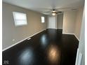 Spacious living room featuring dark hardwood floors at 835 E Berwyn St, Indianapolis, IN 46203