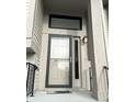 Modern front door with storm door and updated lighting at 9518 Bay Vista E Dr, Indianapolis, IN 46250