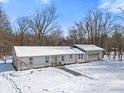 Ranch home with attached garage, winter view at 9791 N Gasburg Rd, Mooresville, IN 46158