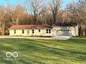 Ranch home with attached garage and expansive lawn at 9791 N Gasburg Rd, Mooresville, IN 46158