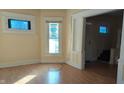 Spacious living room with hardwood floors and access to entryway at 1052 N Mount St, Indianapolis, IN 46222