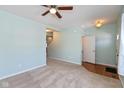 Light teal living room with carpeted floor and ceiling fan at 15256 Harmon Pl, Noblesville, IN 46060