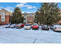 Apartment building with parking lot in winter at 1763 Wellesley Ln # 3G, Indianapolis, IN 46219