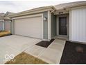 The front facade of a one story home with a two car garage and a grassy front yard at 3231 W Keepsake Ln, Monrovia, IN 46157