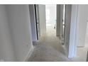 Bright hallway featuring clean white walls, leading to various rooms, emphasizing the home's open layout at 3231 W Keepsake Ln, Monrovia, IN 46157