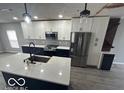 Modern kitchen with white and blue cabinets and quartz countertops at 334 Hamilton Ave, Indianapolis, IN 46201