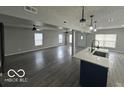 Spacious living room with hardwood floors and high ceilings at 334 Hamilton Ave, Indianapolis, IN 46201