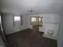 Living room features hardwood floors and a fireplace at 3608 N Kenwood Ave, Indianapolis, IN 46208