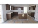 Spacious kitchen featuring an island and dark brown cabinetry at 3945 Highcrest Rd, Indianapolis, IN 46239