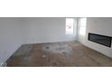Bright living room with a modern fireplace and large windows at 3945 Highcrest Rd, Indianapolis, IN 46239