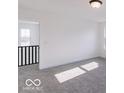 Bright bedroom with gray carpeting and two large windows at 6752 W Buck Stone Dr, McCordsville, IN 46055