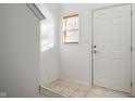 Bright entryway with tiled floor, white door, and window with blinds at 7042 Tyler Ln, Indianapolis, IN 46217