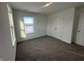 Spacious bedroom with gray carpet and double-door closet at 7824 Magnolia St, New Palestine, IN 46163
