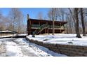 House exterior showcasing a snowy landscape and two car garage at 7887 Elk Dr, Nineveh, IN 46164