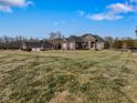 Brick home with detached garage and expansive lawn at 8152 Cottonwood Dr, Martinsville, IN 46151