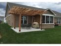 Backyard patio with pergola, seating, and grill at 8737 Twain Ln, Indianapolis, IN 46239