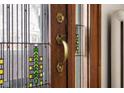 Ornate wood entry door with stained glass accents at 1023 Franklin St, Columbus, IN 47201