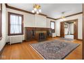 Living room with hardwood floors, fireplace, built-ins at 1023 Franklin St, Columbus, IN 47201