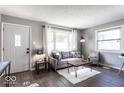Cozy living room featuring a gray sofa and wood floors at 1654 Iowa St, Indianapolis, IN 46203