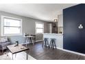 Open living area with gray walls, wood floors, and modern furniture at 1654 Iowa St, Indianapolis, IN 46203
