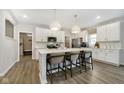 Modern white kitchen with stainless steel appliances and an island at 18932 Seaforth Way, Westfield, IN 46074